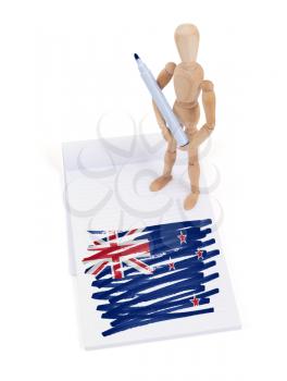 Wooden mannequin made a drawing of a flag - New Zealand