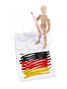 Wooden mannequin made a drawing of a flag - Germany