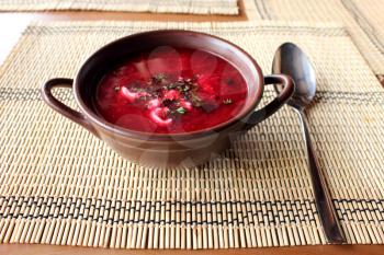 plate wth dish of tasty red Ukrainian borsch