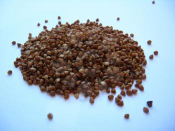 Grains of buckwheat on a white background