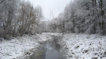 beautiful landscape with winter Ubed river and forest