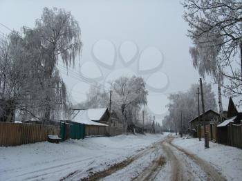 Winter landscape with rural street in snow