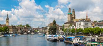Panorama of Historical part of Zurich with famous Fraumunster and Grossmunster churches in a beautiful summer day, Switzerland