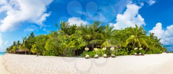 Panorama of Wooden sunbed on tropical beach in the Maldives at summer day