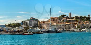 Yachts anchored in port in Cannes in a beautiful summer day, France