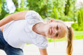 Portrait of cute smiling girl with blond hair