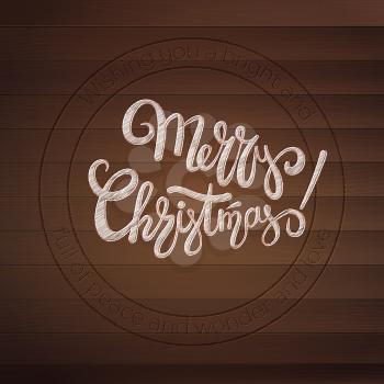 Merry Christmas. Stamp with calligraphic text on wooden texture. Design of handwritten text. Vintage greetings card on wooden planks. Resizable vector illustration, eps10. View on top.