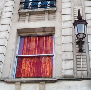 reflection of Notre Dame Cathedral in Reims (France) in windows of next house