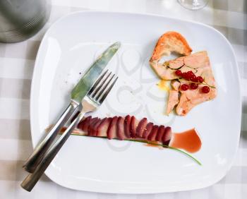 foie gras with strawberry on white plate