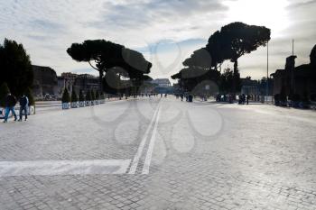 ROME, ITALY - DECEMBER 19: via dei Fori Imperiali and view of Coliseum in Rome, Italy on December 19, 2010. The Via dei Fori Imperiali was built by order of Benito Mussolini from 1924-1932.