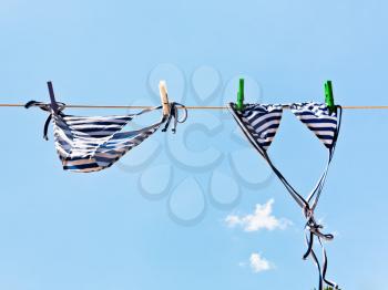 woman swimming bikini suit drying in wind