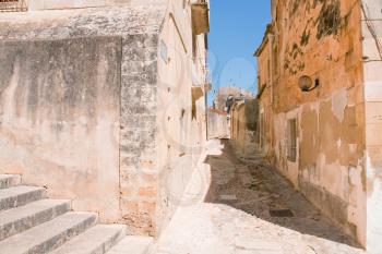 narrow street in baroque style town - Noto, Sicily
