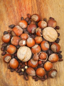 heap of dried nuts on wooden board
