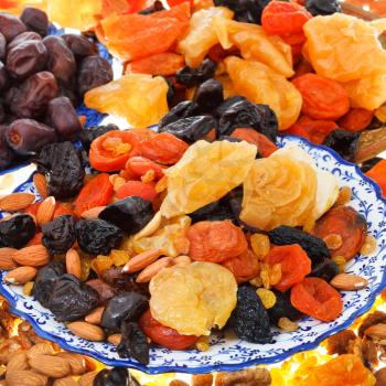 background from sweet dried fruits on asian plates