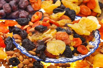 arabic dessert - many dried sweet fruits on plate
