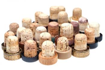 many used corks from alcoholic spirits isolated on white background