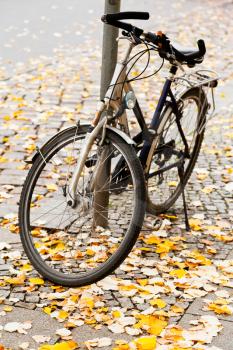 bicycle parked on street in Berlin in autumn day