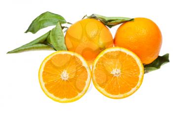 sliced orange and two oranges with green leaves isolated on white background