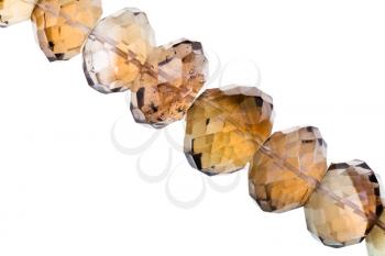 string of smoky quartz beads close up isolated on white background