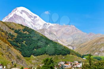 village Stepantsminda at foot of Mount Kazbek in Caucasus Mountains in Georgia