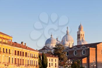 houses on Prato della Valle with a view of the Basilica of Santa Giustina of Padua, Italy at evening