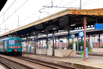 train on railway platform in autumn day