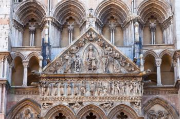 detail of facade of Ferrara Cathedral, Italy