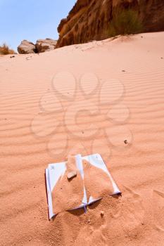 office note book in red sand of Wadi Rum desert in Jordan