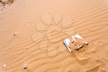 note book in red sand dune of Wadi Rum desert, Jordan