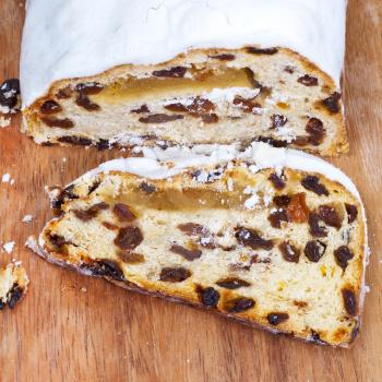 sliced Stollen cake with dried fruit and marzipan close up