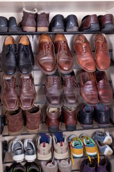 shoes shelves with used leather men's slippers