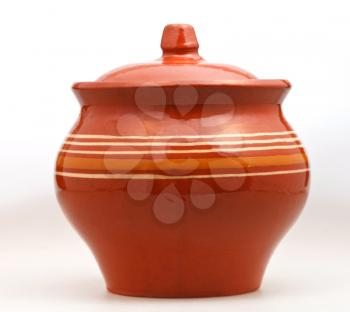 side view of closed earthenware pot on white background