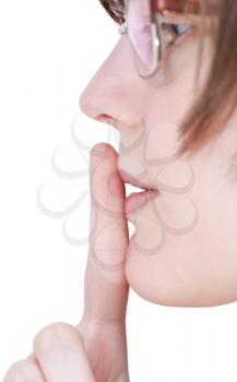 finger near lips close up - silence hand gesture isolated on white background
