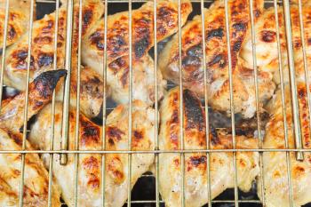 grilled chicken wings on grill close up