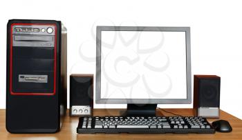 desktop computer, display with cut out screen, keyboard, mouse, speakers on wooden table isolated on white background