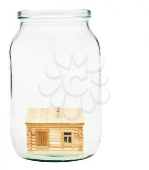 new wooden village house in open glass jar