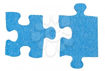 two separated jigsaw puzzle pieces isolated on white background