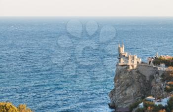 Aurora rock with Swallow's Nest castle on Southern Coast of Crimea in evening