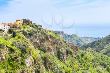 mountain village Savoca in Sicily and sea on horizon, Italy