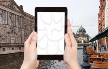 travel concept - tourist photograph Spree river and Berliner Dom, Berlin, Germany on tablet pc with cut out screen with blank place for advertising logo