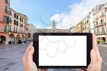 travel concept - tourist photograph Piazza dei Signori and Palazzo del Capitanio in Padua, Italy on tablet pc with cut out screen with blank place for advertising logo