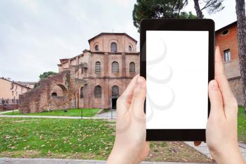 travel concept - tourist photograph Basilica of San Vitale - ancient church in Ravenna, Italy on tablet pc with cut out screen with blank place for advertising logo
