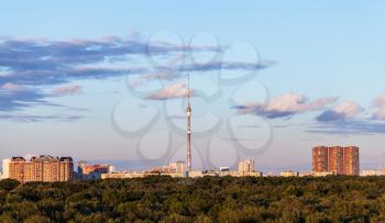 pink clouds in evening blue sky over city with tv tower, Moscow