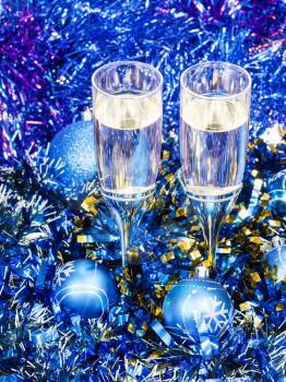 Christmas still life - two glasses of champagne in blue Xmas decorations