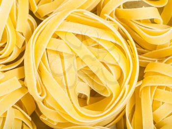 food background - durum wheat semolina pasta fettuccine