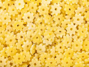 food background - durum wheat semolina pasta stelle close up