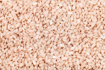 food background - medium-grain uncooked red Matta (Devzira) rice