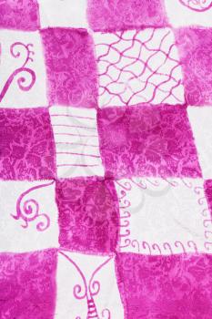 textile background - abstract hand painted pink and white checkered pattern on silk batik