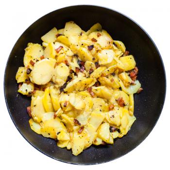 fried potatoes with pork cracklings in round pan isolated on white background