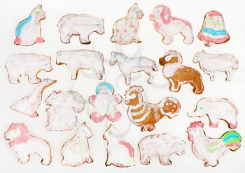 homemade Christmas festive glazed gingerbread cookie - various figure cookies on white background